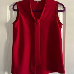 Red sleeveless blouse